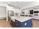 Beautiful kitchen island with a farm sink, stainless steel appliances, and barstool seating at 1520 Banks Brooke Dr, Raleigh, NC 27603