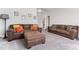 Spacious living area with a pair of sofas and plush ottoman, perfect for relaxation at 1520 Banks Brooke Dr, Raleigh, NC 27603