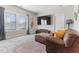 Comfortable living room with large window, plush seating, and a mounted flat-screen TV at 1520 Banks Brooke Dr, Raleigh, NC 27603