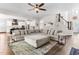 Open-concept living room with a cozy sectional, rug, and hardwood floors at 1520 Banks Brooke Dr, Raleigh, NC 27603