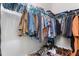 Walk-in closet with metal shelving features hanging storage and ample room for shoes and folded clothing at 1520 Banks Brooke Dr, Raleigh, NC 27603