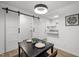 Contemporary dining room equipped with modern lighting and sliding doors, blending style with functional design at 1613 Kilmer Ter, Durham, NC 27703
