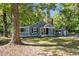 Charming gray house with well-maintained lawn, detached garage, and classic design at 1613 Kilmer Ter, Durham, NC 27703