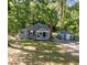 Charming gray house with well-maintained lawn, detached garage, and classic design at 1613 Kilmer Ter, Durham, NC 27703
