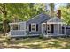 Inviting home showcasing a quaint, covered porch, complete with a charming swing, enhancing its curb appeal at 1613 Kilmer Ter, Durham, NC 27703