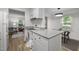 The gorgeous kitchen features white cabinets and granite countertops at 1613 Kilmer Ter, Durham, NC 27703