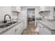 Charming kitchen with granite countertops, double bowl sink, and stainless steel appliances at 1613 Kilmer Ter, Durham, NC 27703