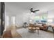 Bright and airy living room featuring hardwood floors, modern decor, and large windows, creating an inviting space at 1613 Kilmer Ter, Durham, NC 27703