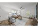 Inviting living room showcasing hardwood floors, large windows, and modern decor, offering a comfortable, stylish atmosphere at 1613 Kilmer Ter, Durham, NC 27703