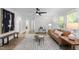 Bright living room featuring hardwood floors, modern decor, and ample natural light, creating a warm atmosphere at 1613 Kilmer Ter, Durham, NC 27703