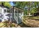 View of rear screened porch entrance with painted steps and concrete paver walkway at 1613 Kilmer Ter, Durham, NC 27703