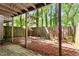 Landscaped backyard featuring a wooden fence and mulch ground cover at 1782 Quail Ridge Rd, Raleigh, NC 27609