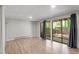 Spacious basement with wood floors, sliding doors, and access to the backyard at 1782 Quail Ridge Rd, Raleigh, NC 27609