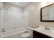 Clean bathroom with white tiled shower, single vanity, and updated fixtures at 1782 Quail Ridge Rd, Raleigh, NC 27609