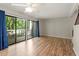 Spacious living room with hardwood floors, sliding glass doors, and a private deck at 1782 Quail Ridge Rd, Raleigh, NC 27609