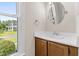 Bathroom featuring window and white vanity sink at 2 Great Oak Ct, Durham, NC 27713