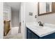 Well-lit half bathroom with a white marble countertop and modern fixtures at 2 Great Oak Ct, Durham, NC 27713