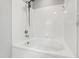 Bathtub featuring a white tile surround, chrome fixtures, and an adjustable shower head at 2 Great Oak Ct, Durham, NC 27713
