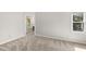 Bedroom featuring neutral walls, carpet, and a window with an outside view at 2 Great Oak Ct, Durham, NC 27713