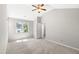 Neutral bedroom with vaulted ceiling, ceiling fan, window, and carpet at 2 Great Oak Ct, Durham, NC 27713