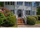Close up of home's main entrance with brick steps and colorful shrubbery at 2 Great Oak Ct, Durham, NC 27713
