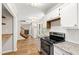 Kitchen with granite countertops, stainless appliances, and open floor plan at 2 Great Oak Ct, Durham, NC 27713
