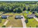Aerial view showcases the property, with its spacious lawn, fenced yard, and proximity to neighborhood amenities at 2006 Woodstone Dr, Archer Lodge, NC 27527