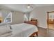 Primary bedroom features vaulted ceiling and natural light and hardwood floors creating a serene atmosphere at 2006 Woodstone Dr, Archer Lodge, NC 27527