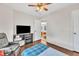 This bedroom includes a tv, wood-look floors and a window letting in plenty of natural light at 2006 Woodstone Dr, Archer Lodge, NC 27527