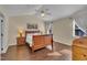 Spacious bedroom with vaulted ceiling, ceiling fan, and two windows bringing in an abundance of natural light at 2006 Woodstone Dr, Archer Lodge, NC 27527