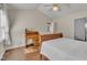 Relaxing bedroom features a vaulted ceiling, ceiling fan, and well-maintained desk, creating a serene atmosphere at 2006 Woodstone Dr, Archer Lodge, NC 27527