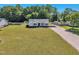 Aerial front exterior view with a carport and a lush green lawn offering great curb appeal at 2006 Woodstone Dr, Archer Lodge, NC 27527