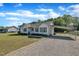 Charming single-story home with well-manicured lawn, a carport, and classic curb appeal at 2006 Woodstone Dr, Archer Lodge, NC 27527