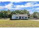 Charming home features a well-maintained lawn, tasteful landscaping, and a convenient covered parking area at 2006 Woodstone Dr, Archer Lodge, NC 27527