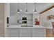 Stylish kitchen with white cabinetry, stainless steel appliances, and a view into the bedroom at 2006 Woodstone Dr, Archer Lodge, NC 27527