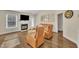 Comfortable living room with hardwood floors, fireplace, and plenty of natural light creating a warm ambiance at 2006 Woodstone Dr, Archer Lodge, NC 27527