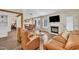 Open-concept living room boasts fireplace, hardwood floors, and is great for relaxing after a long day at 2006 Woodstone Dr, Archer Lodge, NC 27527
