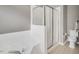 Clean bathroom with a shower and tub at 2018 Waterton Ln, Apex, NC 27502