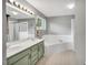 Bright bathroom with double sinks, tub, and shower at 2018 Waterton Ln, Apex, NC 27502