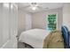 Bedroom with a ceiling fan, carpet, large window and light-colored walls at 2018 Waterton Ln, Apex, NC 27502