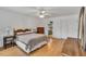 Cozy bedroom featuring hardwood floors and plenty of natural light at 2018 Waterton Ln, Apex, NC 27502