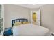 Bedroom with a bed, ceiling fan and view of a bathroom through an open door at 2018 Waterton Ln, Apex, NC 27502