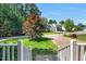 View of the exterior from the front porch, showcasing the well-manicured lawn at 2018 Waterton Ln, Apex, NC 27502