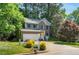 Charming brick home with a yellow front door and well-maintained landscaping at 2018 Waterton Ln, Apex, NC 27502