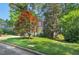 Charming brick home with a yellow front door and well-maintained landscaping at 2018 Waterton Ln, Apex, NC 27502