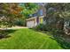Charming brick home with a yellow front door and well-maintained landscaping at 2018 Waterton Ln, Apex, NC 27502