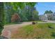 Charming home with well-manicured lawn and an expansive driveway leading to the attached garage at 2018 Waterton Ln, Apex, NC 27502