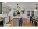 Kitchen area featuring hardwood floors, breakfast bar, and stainless steel appliances at 2018 Waterton Ln, Apex, NC 27502