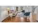 Bright living room featuring hardwood floors, sofa, and two accent chairs at 2018 Waterton Ln, Apex, NC 27502