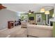 Inviting living room with neutral carpet, fireplace, lots of natural light, and a ceiling fan at 2018 Waterton Ln, Apex, NC 27502